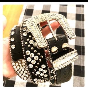 **BUCKLE**  Leather rhinestone studded belt